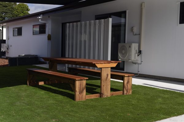 Outdoor timber table and bench seating at Mi Casa Su Casa, Silkstone