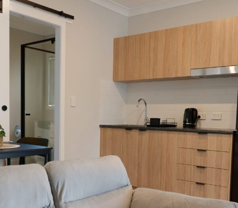 Modern accessible kitchen and living area in an Aspire Hub home